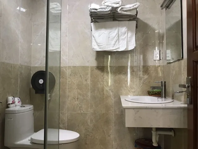 غرفة ديلوكس رباعية بسريرين مزدوجين بإطلالة على المتنزه، Green Park Hotel Quy Nhon 4/7