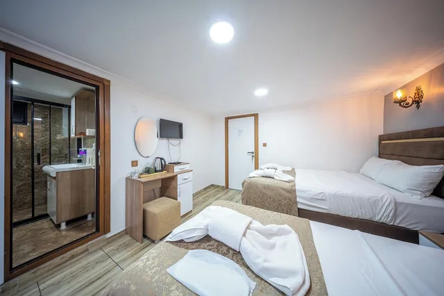 غرفة اقتصادية رباعية بسرير مزدوج وسريرين منفصلين بغرفة نوم واحدة، Laos Otel 1/10