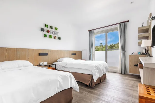 غرفة بسريرين منفصلين بشرفة، Kenting Fairyland & Farm Guest House 10/10