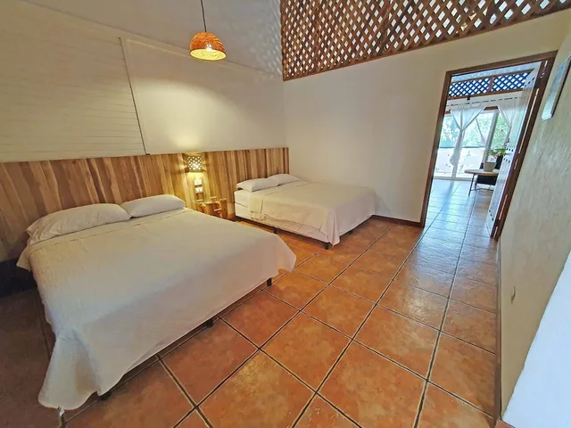 جناح عائلي بسرير كينج وسريرين مزدوجين بإطلالة على البحر، Cariblue Beach Jungle Resort 5/10