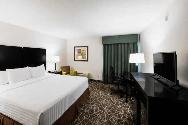غرفة بسرير كوين، Garden Executive Hotel 1/1