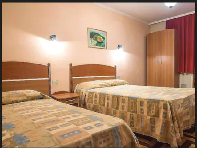 غرفة رباعية بسرير مزدوج وسريرين منفصلين، Itajuba Hotel 1/6