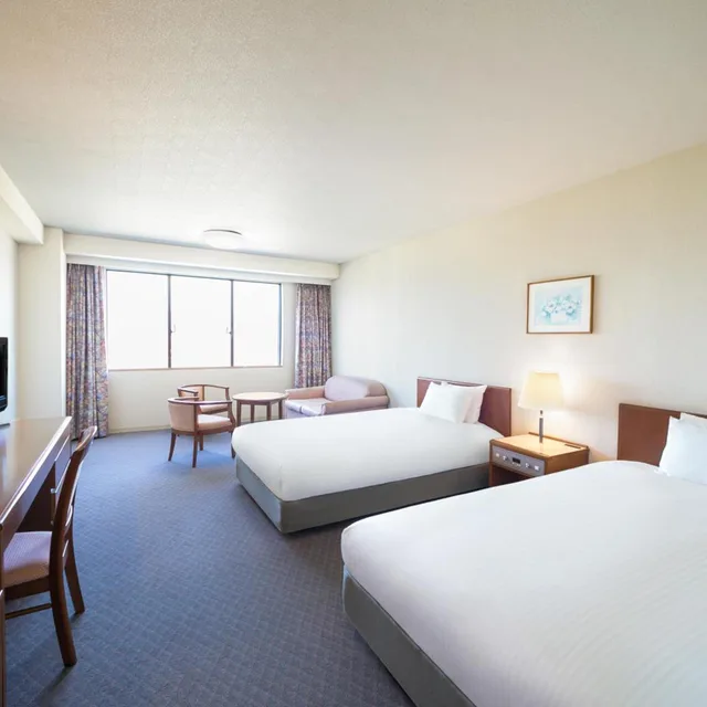 غرفة كلاسيكية بسريرين منفصلين بإطلالة جزئية على البحر مع أريكة، Grand Mercure Wakayama Minabe Resort & Spa 1/1