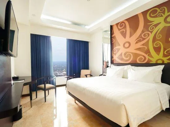 غرفة ديلوكس بسرير كينج وسرير كوين، M Bahalap Hotel Palangkaraya 1/1
