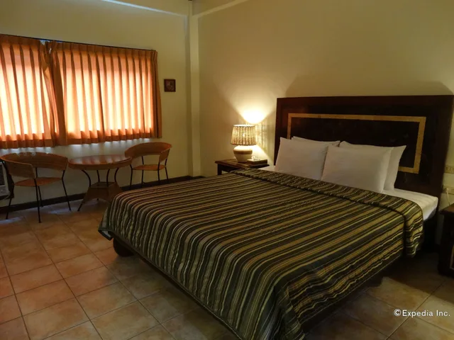غرفة ديلوكس تنفيذية بسرير كينج، Citystate Asturias Hotel Palawan 2/10