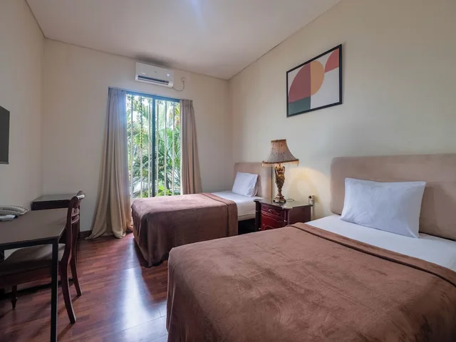 غرفة ديلوكس بسريرين منفصلين، Arimbi Pejaten Suites 4/8