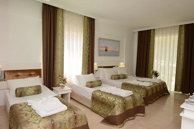 غرفة قياسية بسرير مزدوج أو سريرين منفصلين بإطلالة على الحديقة، Onkel Hotels Beldibi Resort 1/3