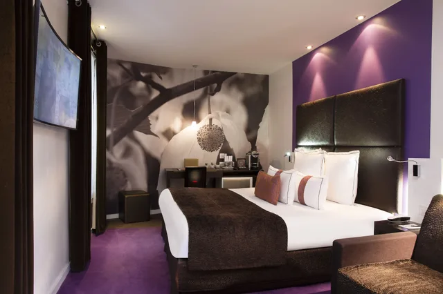 غرفة ديلوكس ثلاثية بسرير كوين مع أريكة، Grand Hotel Saint Michel 2/7