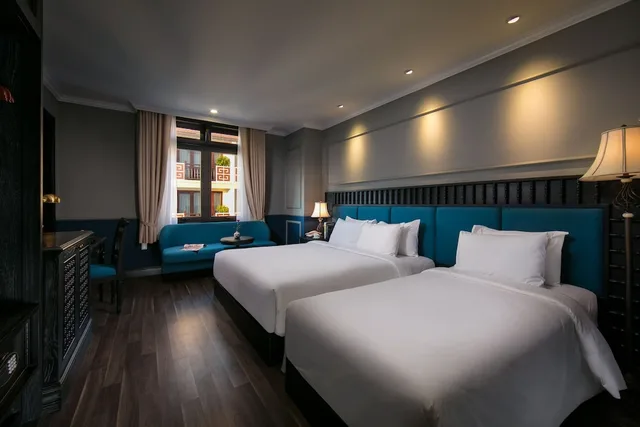 غرفة ديلوكس ثلاثية بسرير كينج وسرير فردي بإطلالة على المدينة، Golden Holiday Hoi An Hotel 2/10