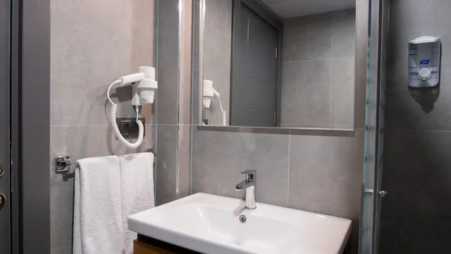 Suite, King Bed, Sofa, Opera Suites 2/2