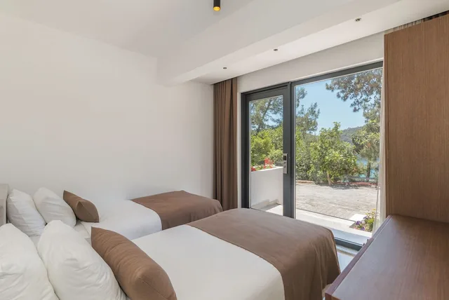 غرفة عائلية رباعية بسرير كوين وسريرين منفصلين بإطلالة على الحديقة، Meri Hotel Oludeniz 2/5