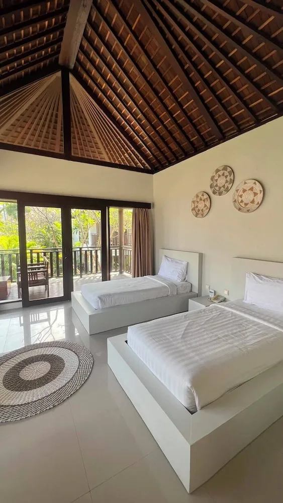 غرفة بسريرين منفصلين بإطلالة جزئية على البحر، Living Asia Resort Spa Lombok 1/2