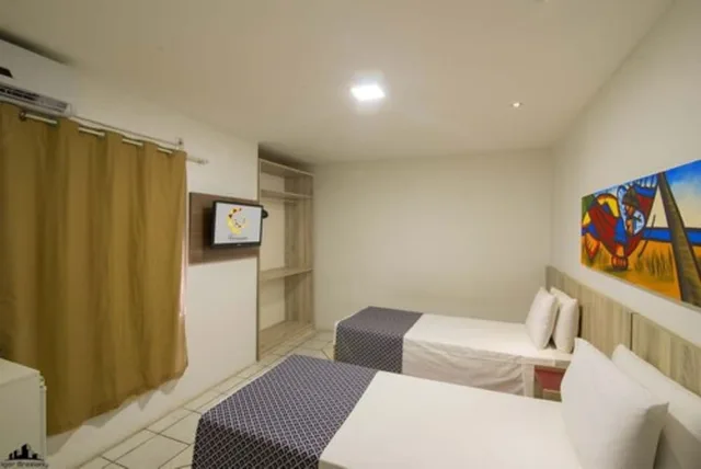 غرفة ديلوكس ثلاثية بسرير مزدوج وسرير فردي، Netuanah Praia Hotel 1/3