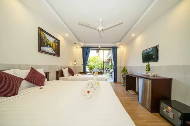 غرفة ديلوكس ثلاثية بسرير كوين وسرير فردي، Bonsai Homestay 1/2