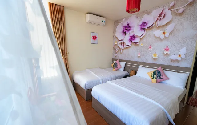 غرفة عائلية بسرير كينج وسرير فردي بإطلالة على الحديقة، Flora Hotel Hue 7/10
