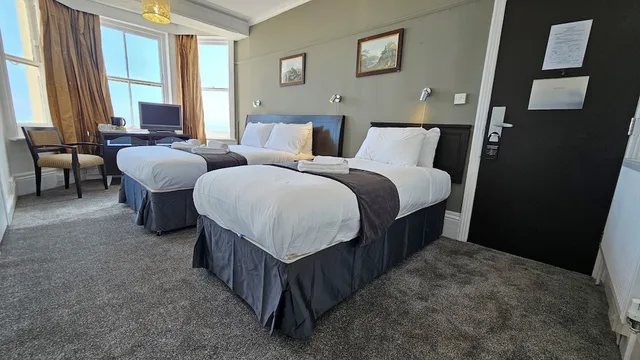 Family, 1 Double and 1 Single Bed, OYO The Strand Hotel 3/6