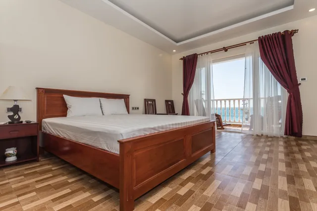 غرفة ديلوكس بسرير كينج بإطلالة على البحر، Phuong Binh House 1/6