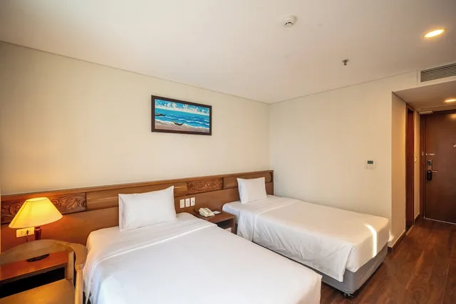 غرفة ديلوكس بسريرين منفصلين بإطلالة جزئية على البحر، Tamarind Hotel Da Nang 3/10