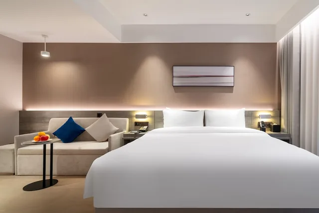 غرفة بسرير كينج مع أريكة، Huidong Business Hotel 1/4