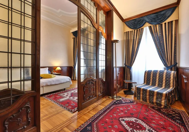 غرفة سوبيريور بسرير كوين وسرير فردي بمنطقة جلوس، Best Western Hotel Moderno Verdi 4/6