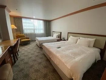 غرفة ديلوكس عائلية بثلاثة أسرّة، Hotel International 1/2