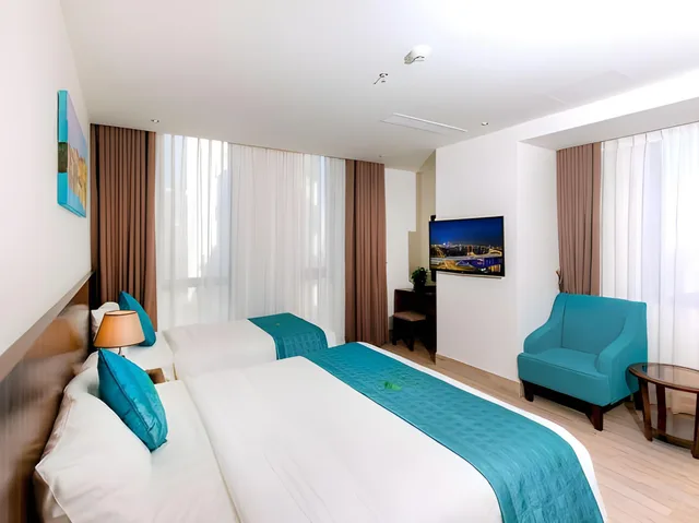 غرفة ديلوكس ثلاثية بسرير كوين وسرير فردي، Greenery Hotel 1/2