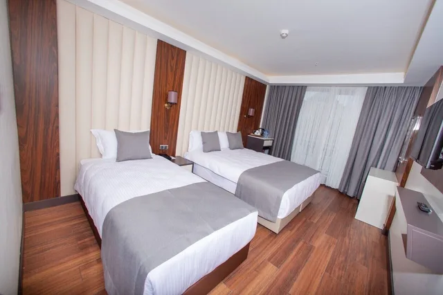 غرفة عائلية بسرير مزدوج وسرير فردي، Shining Star Hotel 1/4