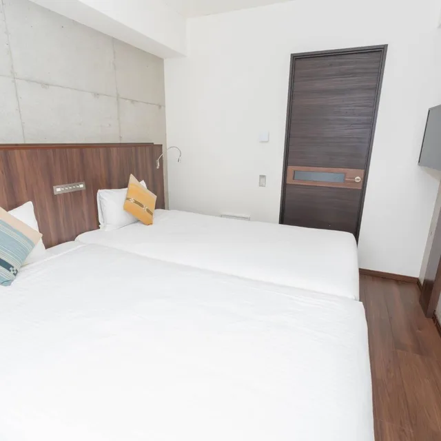 شقة سكنية بسريرين منفصلين بمطبخ مع دخول الصالة، The Breakfast Hotel Porto Ishigaki 1/10