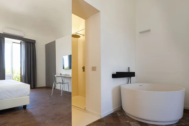 جناح جونيور بسرير كينج مع أريكة بحوض استحمام، Ramo D Aria Etna Boutique Hotel 6/7