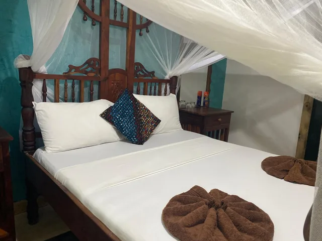 غرفة بسرير مزدوج بإطلالة على الحديقة، Mbuyuni Beach Village 5/10