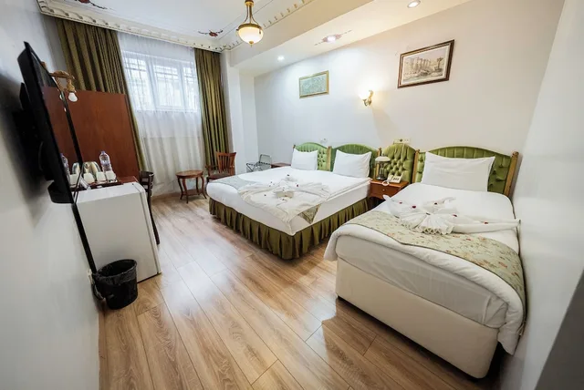 غرفة اقتصادية ثلاثية بسرير مزدوج وسرير فردي، Basileus Hotel 1/8