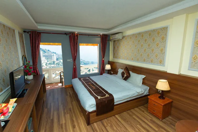 غرفة متصلة ديلوكس عائلية بسريرين منفصلين بشرفة، Sapa Unique Hotel 1/2