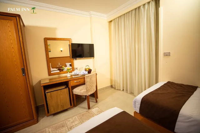 غرفة مفردة بسرير كوين، Palm Inn Hotel 5/9
