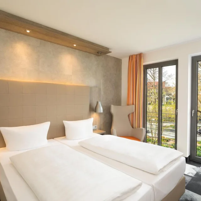 غرفة بسرير مزدوج بإطلالة، Hotel Kramerbrucke Erfurt 1/4