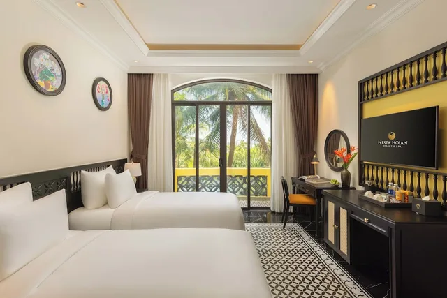 غرفة سيغنتشر بسريرين منفصلين بإطلالة على المسبح، Nesta Hoi An Resort and Spa 1/10