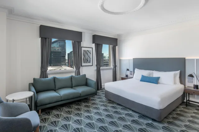 Corner Plaza Room, The Savoy Hotel On Little Collins 1/1