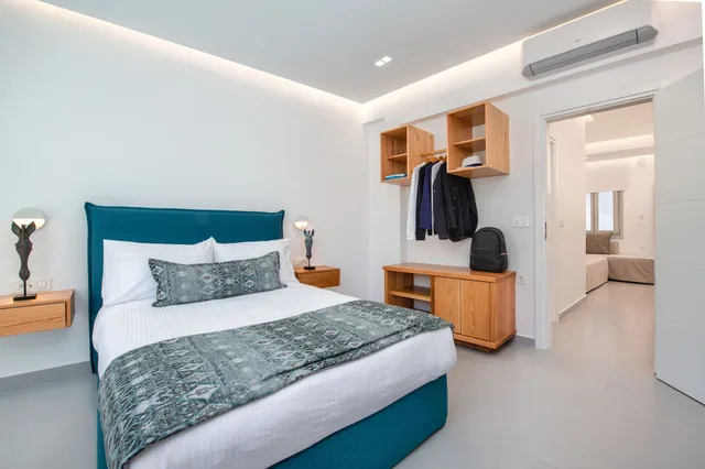 جناح ديلوكس بسرير كوين مع أريكة، Harmony Suites 4/10