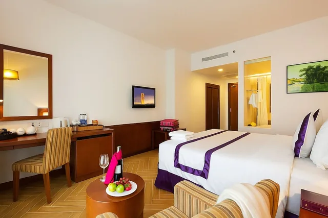 غرفة ديلوكس بسرير كينج بإطلالة جزئية على البحر، TTC Hotel - Michelia 7/10