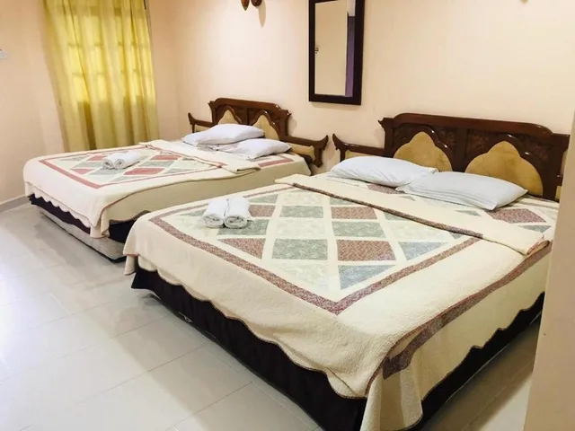 غرفة قياسية رباعية بسريرين مزدوجين، Penarak Bamboo Beach Motel 1/1