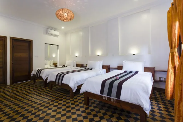 غرفة ديلوكس ثلاثية بثلاثة أسرّة بإطلالة على المسبح، Le Jardin d'Angkor Hotel 3/3