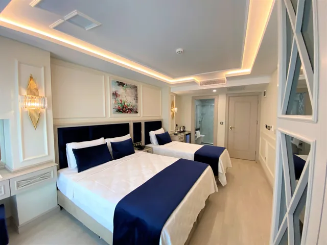 غرفة ديلوكس ثلاثية بسرير مزدوج وسرير فردي، Omma Hotel 2/4