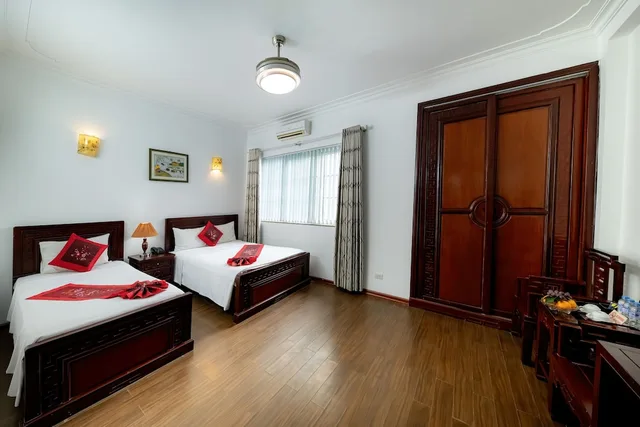 غرفة ديلوكس عائلية بسرير كوين وسرير فردي، Phoenix Legend Hotel 6/10