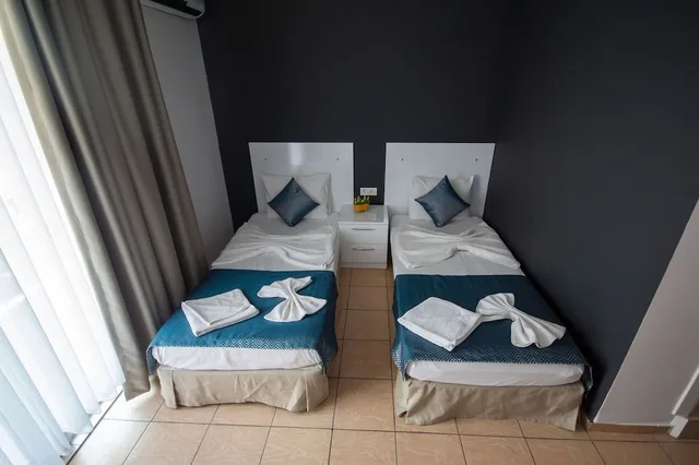 غرفة قياسية بسريرين منفصلين، Moonbow Beach Hotel 1/7