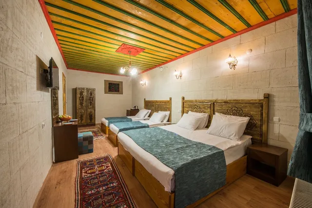 غرفة عائلية بسرير كينج وسريرين منفصلين، Garden Inn Cappadocia 1/7