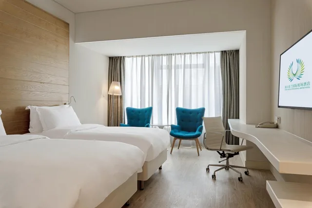 غرفة قياسية بسريرين منفصلين، Garden Lane Meilan Airport Hotel Formerly Haikou Meilan Airport Hotel 1/3