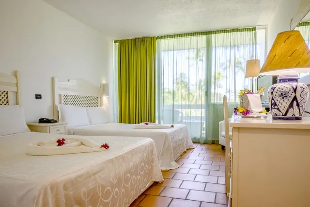 غرفة كلاسيكية رباعية بسريرين كوين، VOI Andilana Beach Resort 1/3