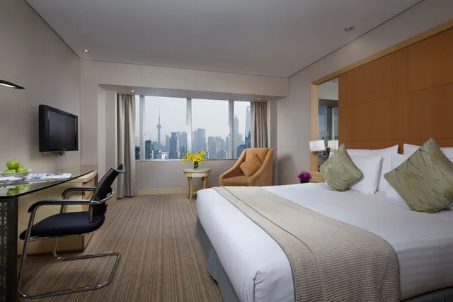 غرفة ديلوكس بسرير كينج بإطلالة على المدينة، Jin Jiang Tower Hotel 3/9