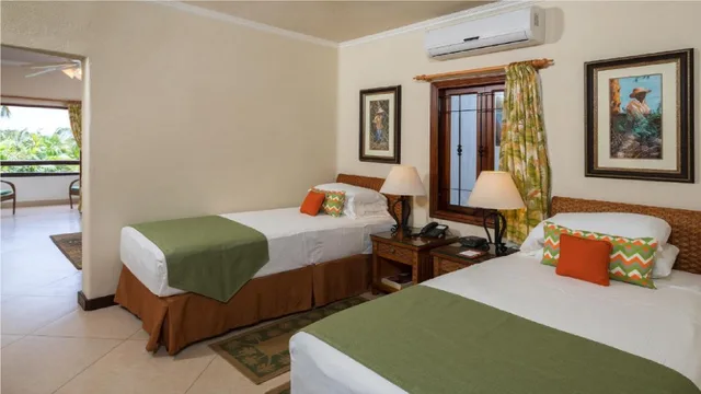 جناح بسريرين منفصلين بإطلالة على البحر، Sugar Cane Club Hotel & Spa 1/1