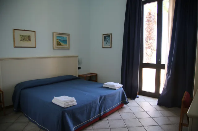 غرفة قياسية ثلاثية بسرير كوين وسرير فردي، Hotel Miramare 1/7
