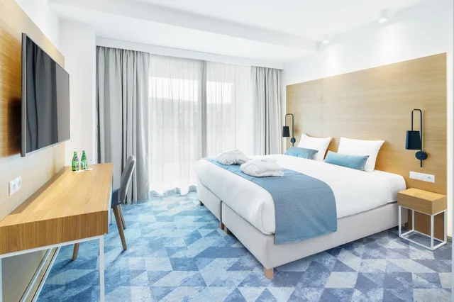 شقة بسرير كينج وسريرين منفصلين مع أريكة، Seaside Park Hotel 1/3